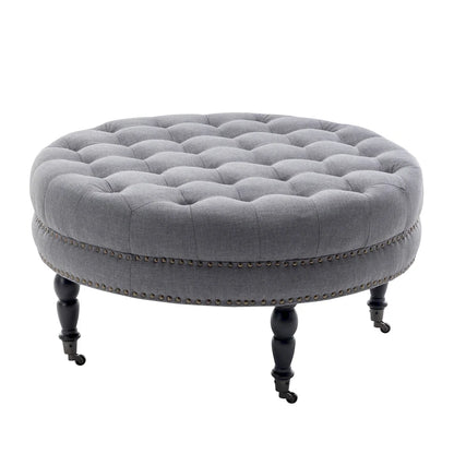 Porthos Home Indy Fabric Round Cocktail Ottoman with Rubberwood Legs and Wheels